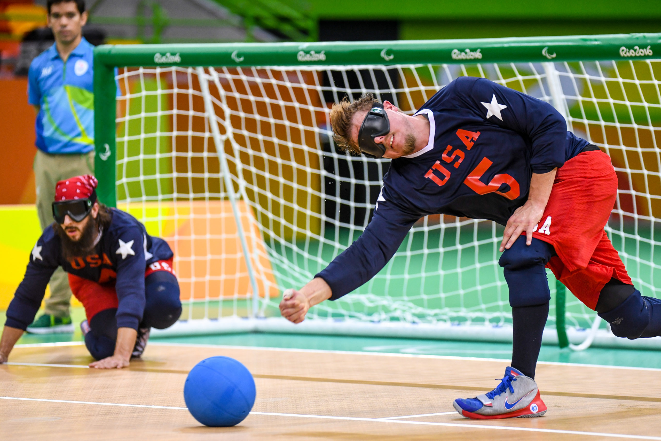 Male athletes playing goalball
