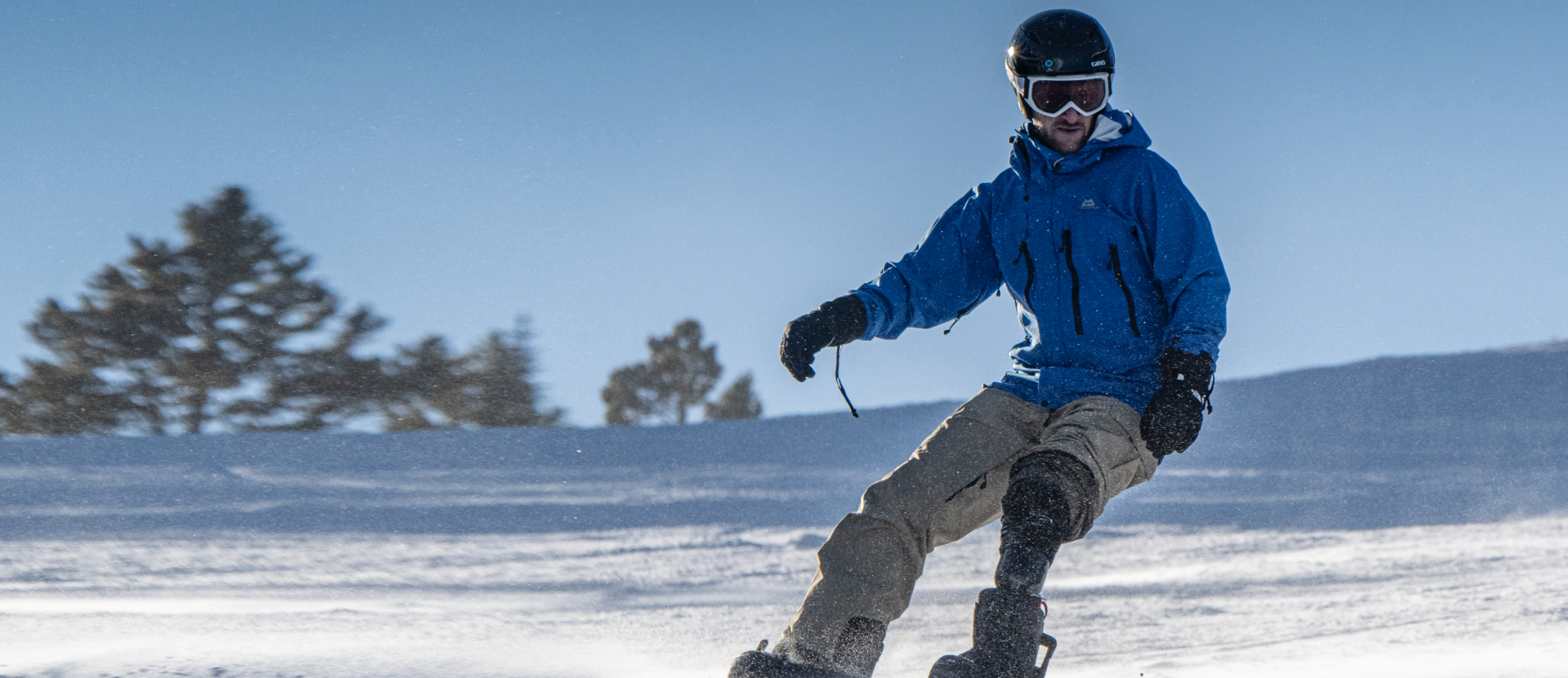 Ski Spec athlete snowboarding on ski slope