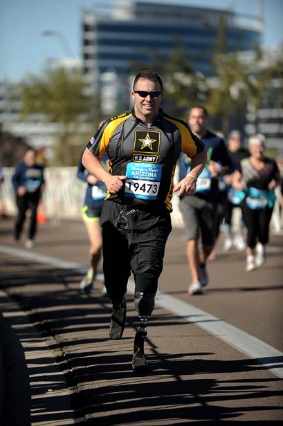 Male athlete with double leg amputation competing in a race