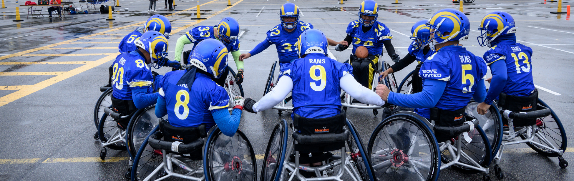 Teammates from the Los Angeles Rams form a huddle